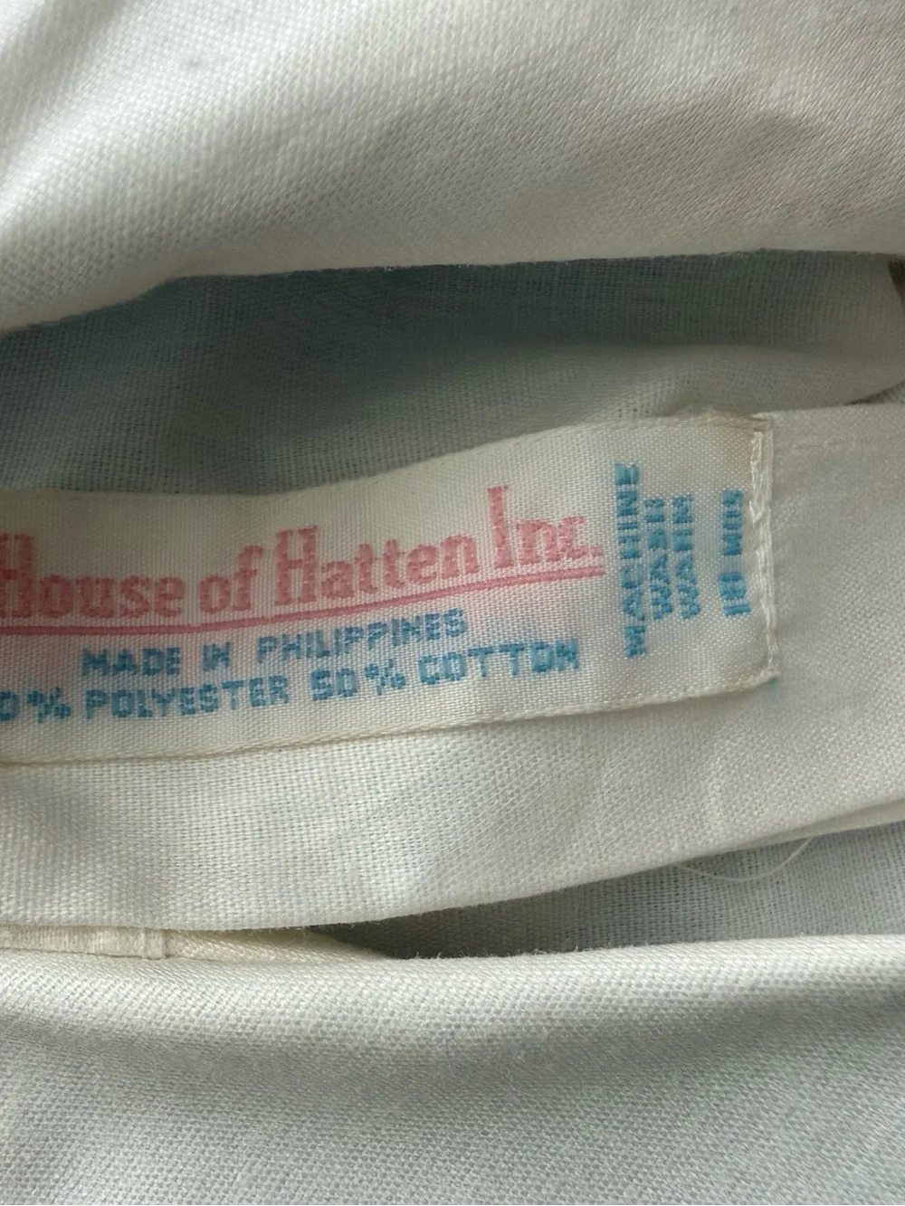 House of Hatten Smocked Blue & White Baby Romper with Colorful Truck Motif